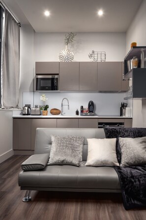 Luxury Apartment | Living area | 55-inch LED TV with cable channels, TV