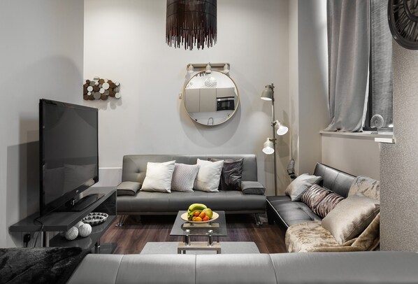 Luxury Apartment | Living area | 55-inch LED TV with cable channels, TV