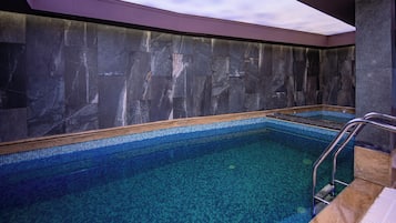 Indoor pool, open 10:00 AM to 8:00 PM, pool loungers