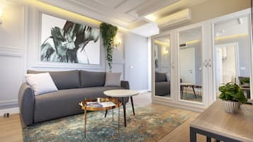 Comfort Apartment | Living area | 32-inch flat-screen TV with cable channels, TV