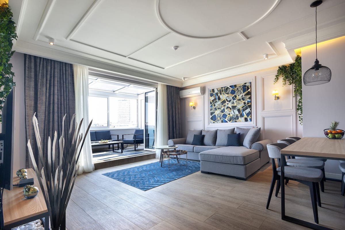 Design Apartment | Living area | 32-inch flat-screen TV with cable channels, TV