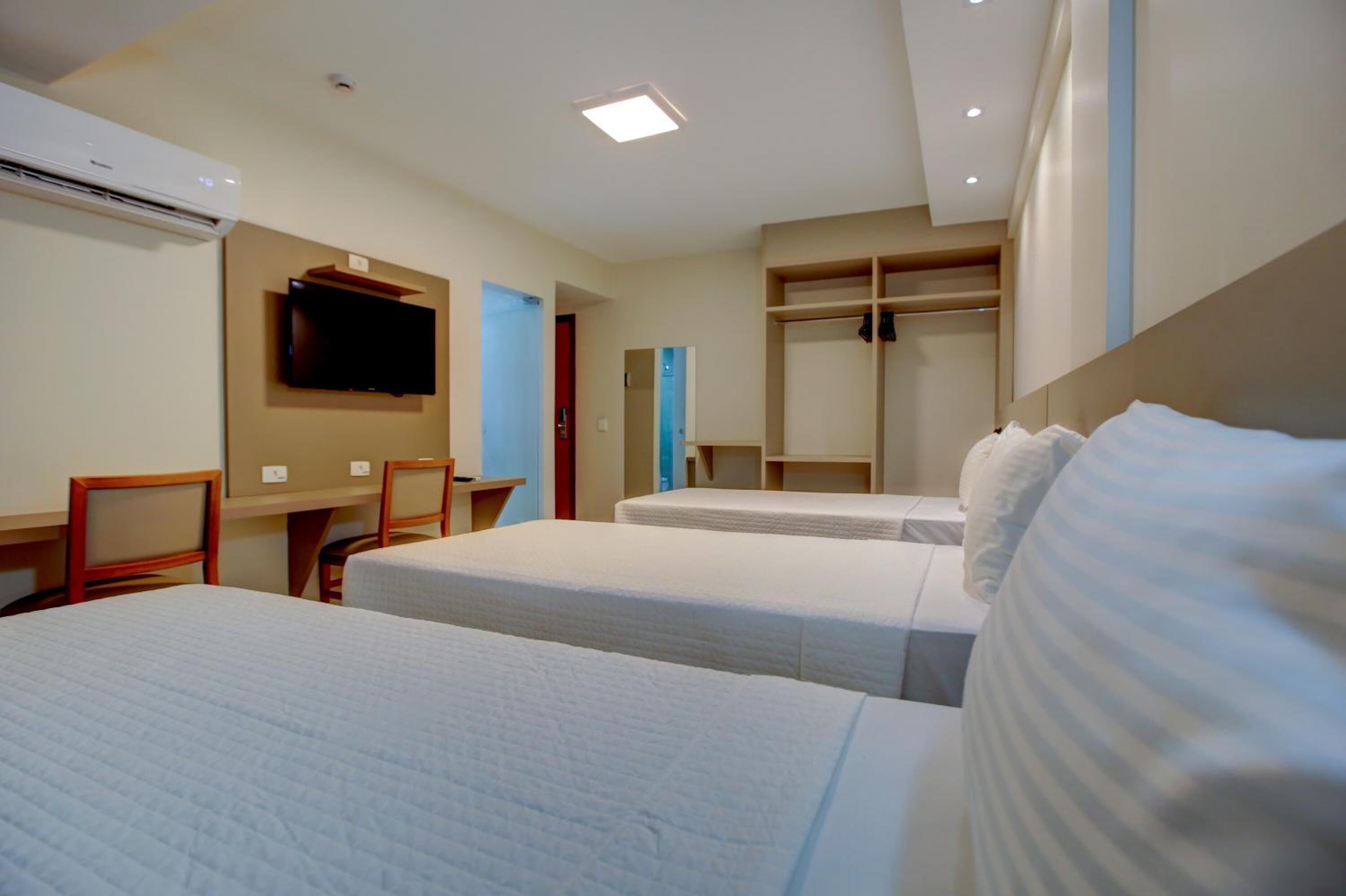 laptop workspace, blackout curtains, soundproofing, iron/ironing board