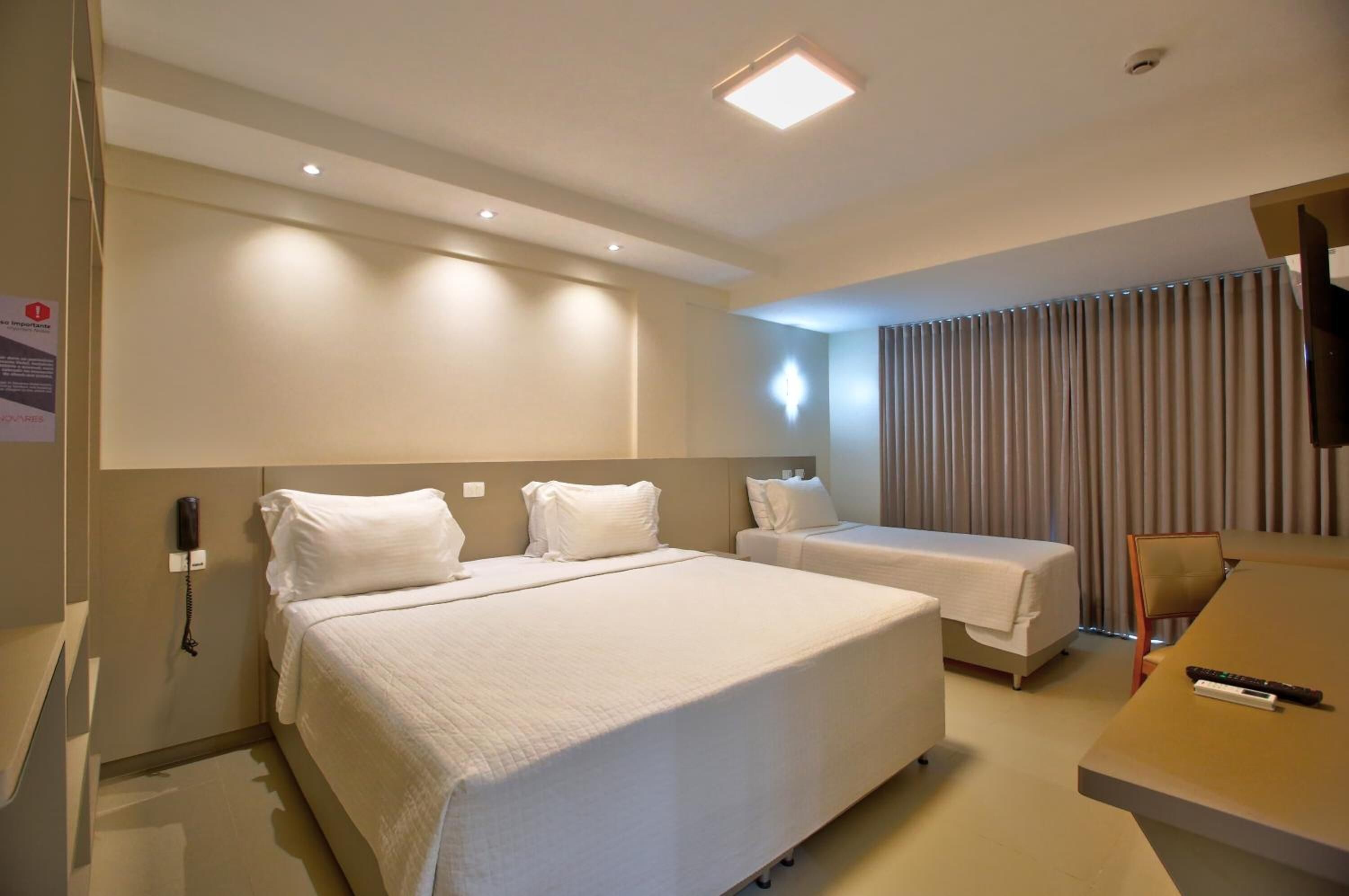 laptop workspace, blackout curtains, soundproofing, iron/ironing board