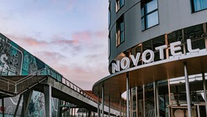 A hotel named NOVOTEL with a modern architectural design, featuring large windows and a curved facade. - Novotel Angers Centre Gare (Angers)