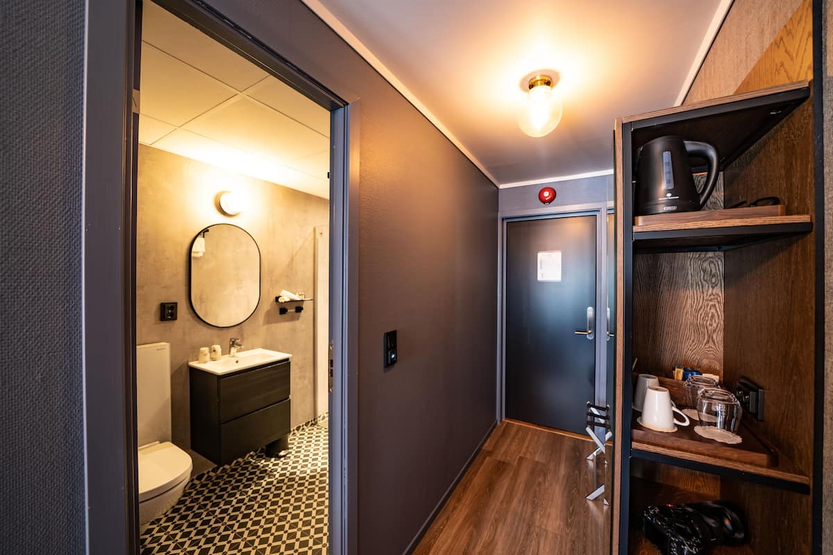 deluxe quadruple room | bathroom | hair dryer, towels