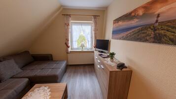 Departamento, 1 habitación | Área de sala de estar