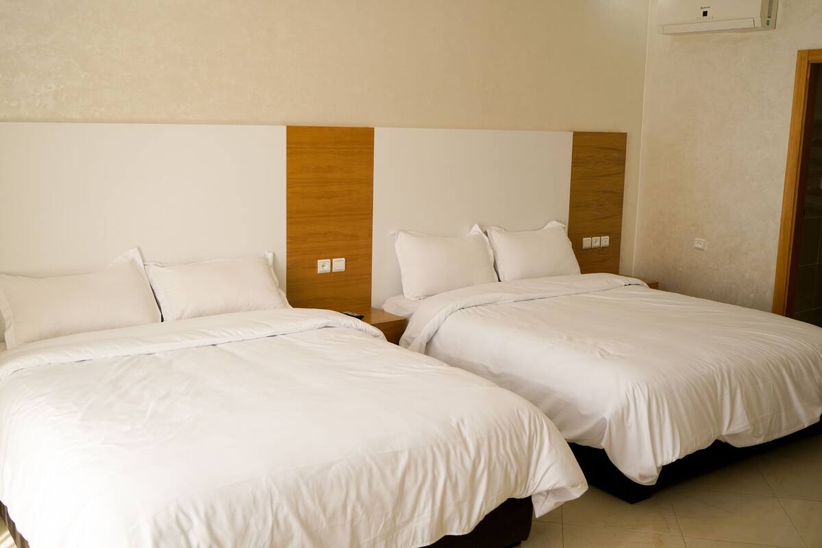 Twin Room | Minibar, in-room safe, desk, blackout drapes