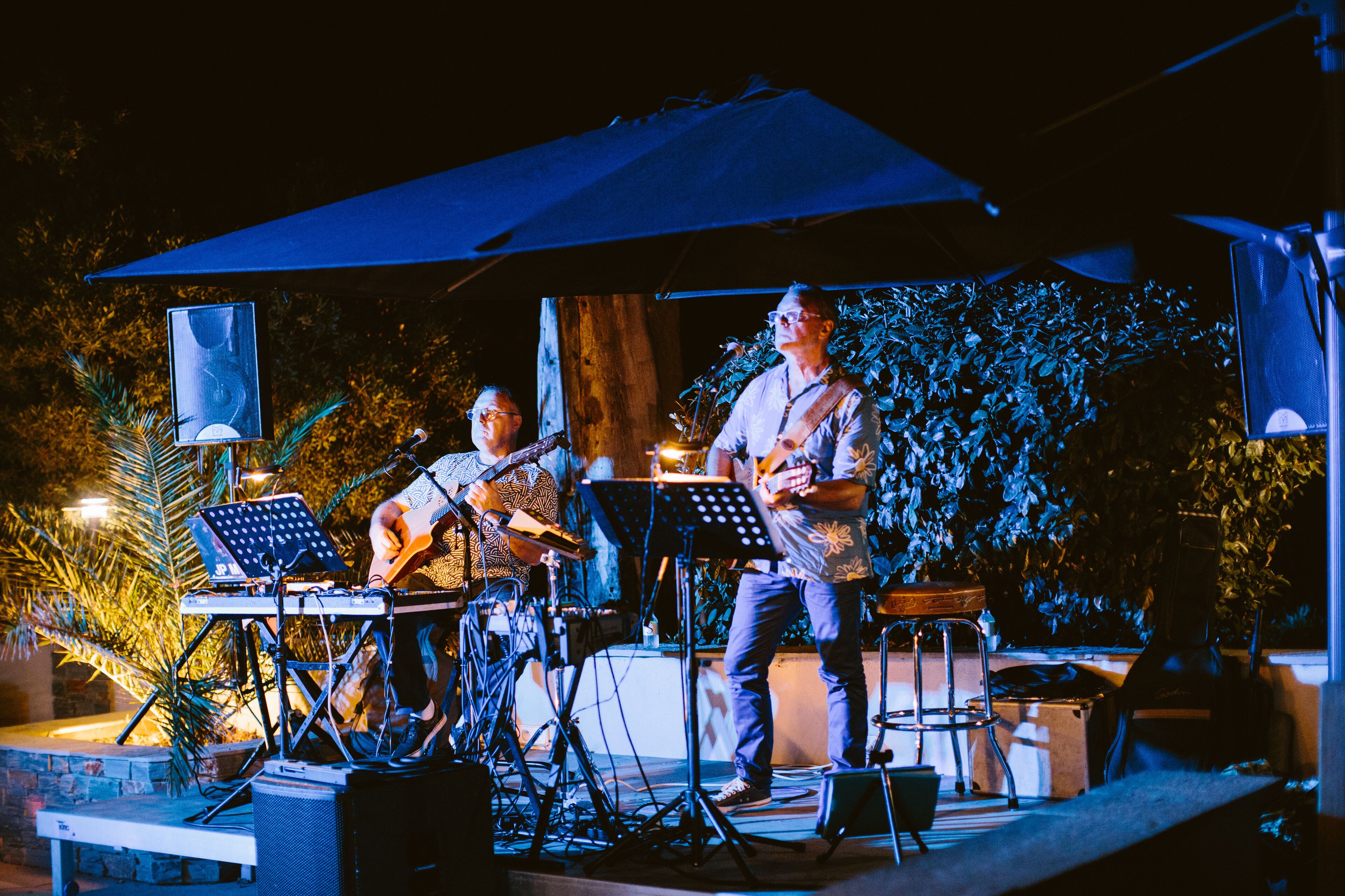 A stage with musical instruments and a microphone stand.