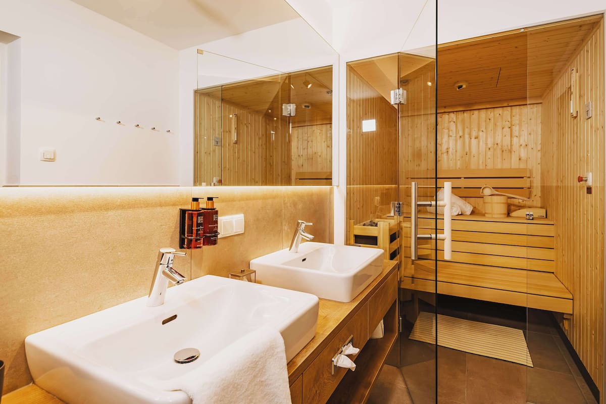 shower, designer toiletries, hair dryer, bathrobes