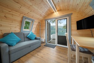 Grand Luxury Beach Pod | Living area | 32-inch flat-screen TV with cable channels