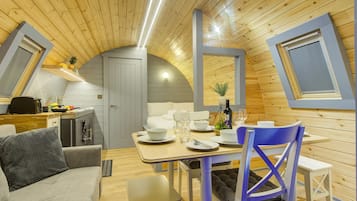 Luxury Beach Pod | Living area | 32-inch flat-screen TV with cable channels