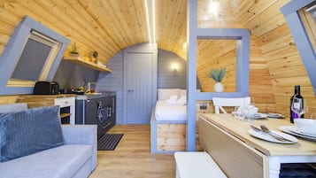 Luxury Beach Pod | Living area | 32-inch flat-screen TV with cable channels