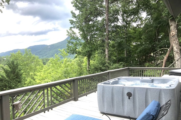 Amazing mountain views from the hot tube and lots of seating to relax.