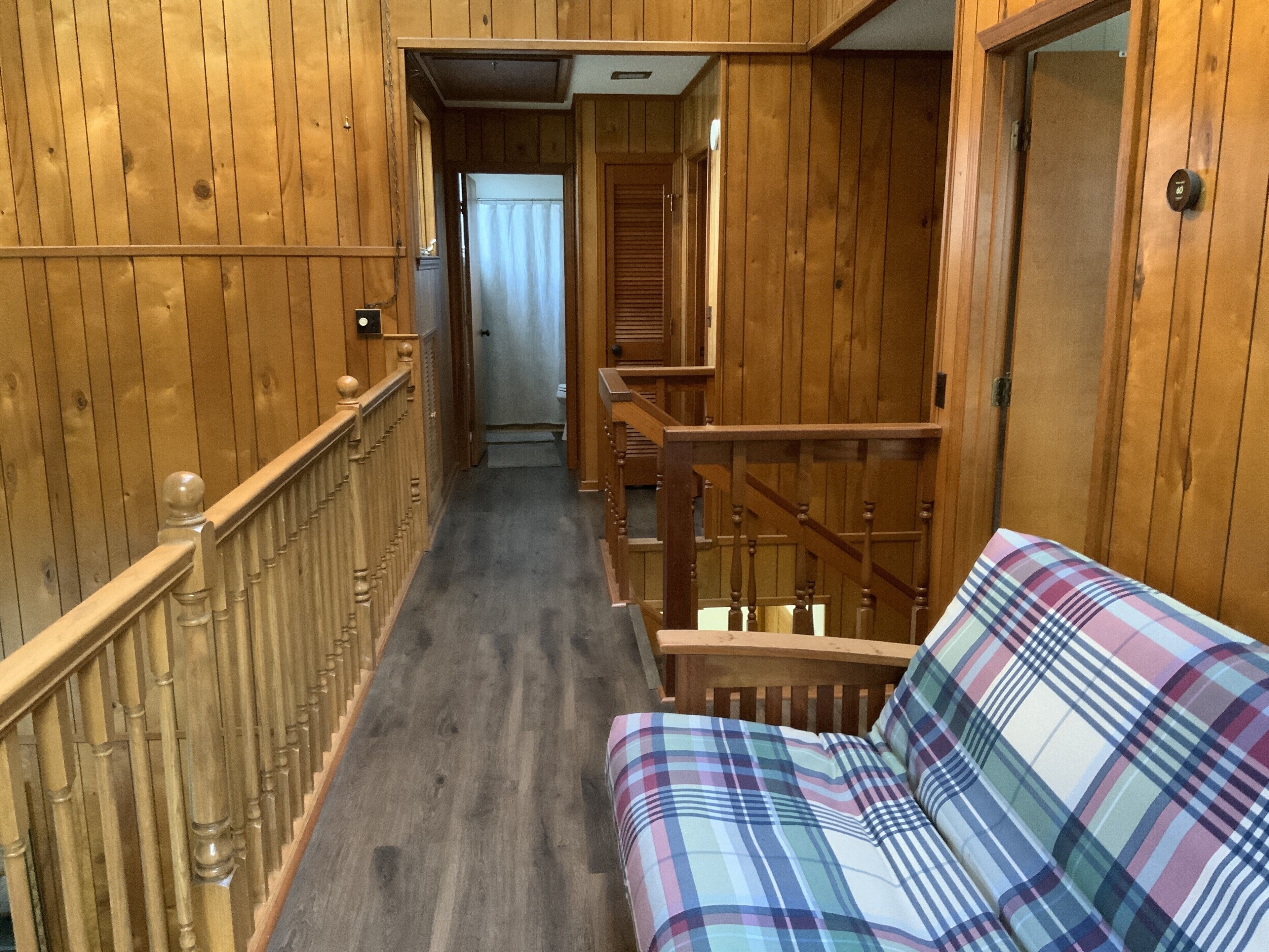 Second story balcony with full bath at end of hall