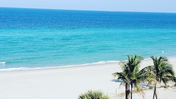 On the beach, sun loungers, beach towels