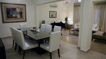 Executive Double Room | Living room | 42-inch flat-screen TV with cable channels, TV, DVD player