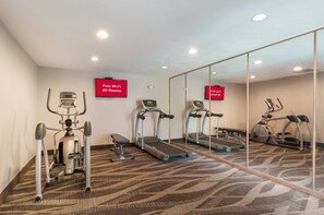 Stay active with our fully equipped fitness room featuring a treadmill, stationary bike, and stair climber.