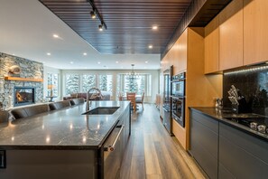 Enjoy cooking in this well-equipped kitchen with a large island, oven, and microwave.