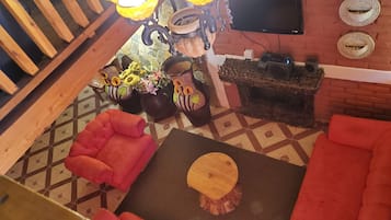 Deluxe Cabin, 2 Bedrooms, Mountain View | Living area | 32-inch flat-screen TV with satellite channels, TV
