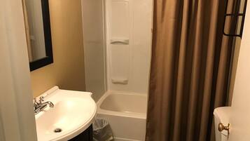 Combined shower/bathtub, towels, soap, shampoo