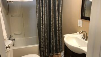 Combined shower/bathtub, hair dryer, towels, soap
