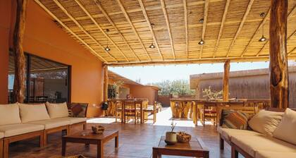 Peumayen Atacama / Hostal & Cabaña