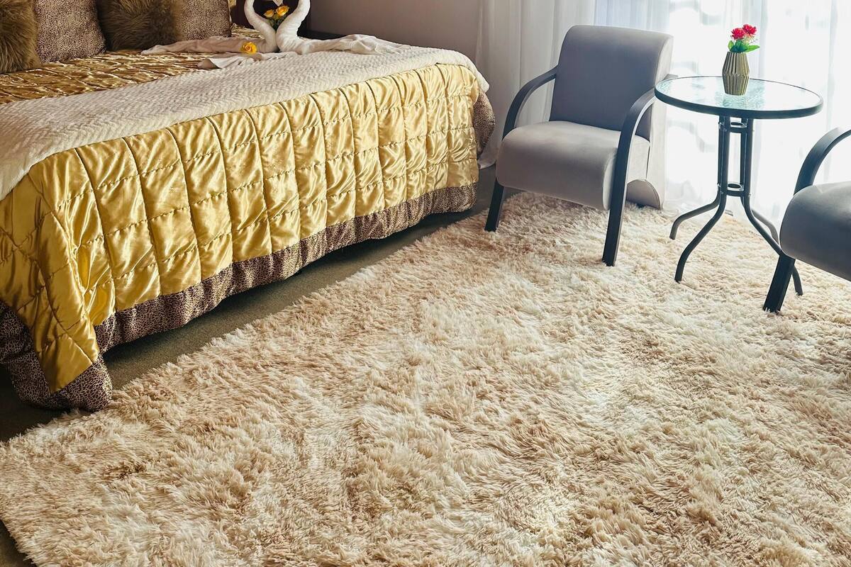 Suíte premium | 8 quartos, frigobar, Wi-Fi de cortesia, roupa de cama