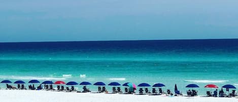 On the beach, sun-loungers