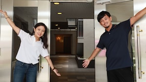 A hotel entrance with a modern design, including a glass door and a visible hallway leading to the interior. - IBASHO Shibuya Higashi 604 (Tokyo)