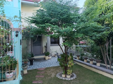 Terrace/patio. A self-contained BnB with a large beautiful garden with many amenities.