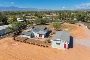 A residential area with multiple houses, a clear sky, and distant mountains. - Rustic Cottage Feel, Close to Wineries, Sleeps 6! (Cornville)