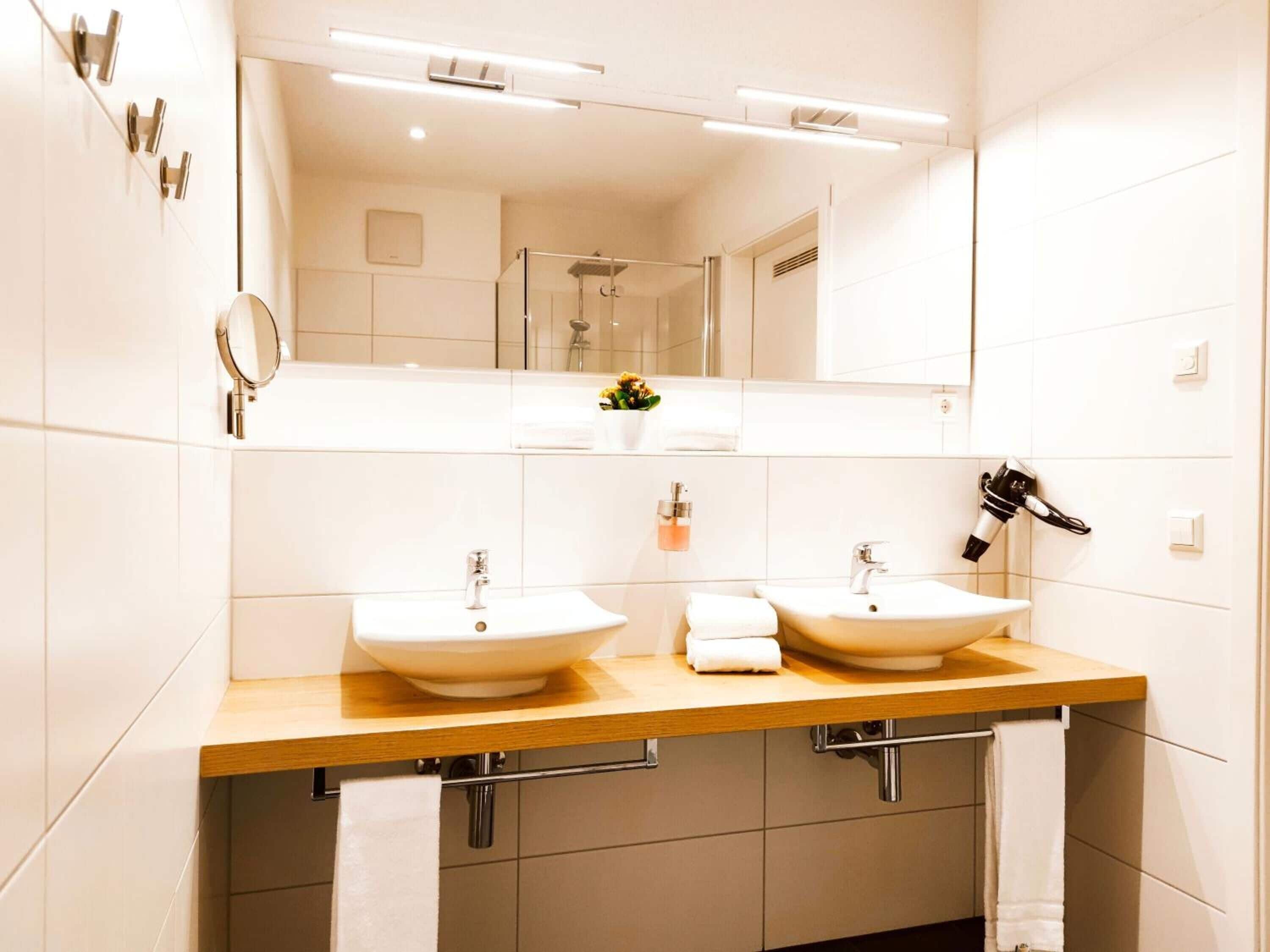 family room | bathroom | shower, rainfall showerhead, hair dryer, heated floors