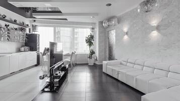 Apartment, 1 Bedroom | Living room | Flat-screen TV