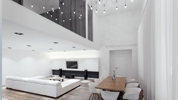 A modern living room with a white sofa, a dining table with chairs, and a TV mounted on the wall. - Royal Apartment Primorskiy bulvar 1 (Odesa)