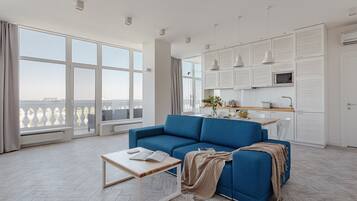 Apartment, 1 Bedroom, Terrace | Living area | 65-inch Smart TV with digital channels, TV