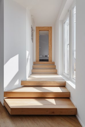 Stunning staircase with clean lines and a contemporary design, leading to an upper floor.