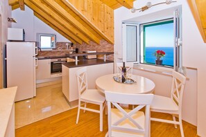 Dining tables - This is a house, with a large and astonishing view at the beach and open sea. (Hvar)