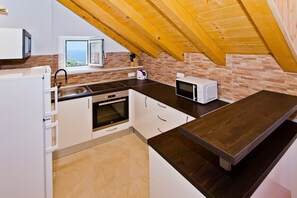 Dining tables - This is a house, with a large and astonishing view at the beach and open sea. (Hvar)