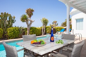 A heated pool, sun loungers