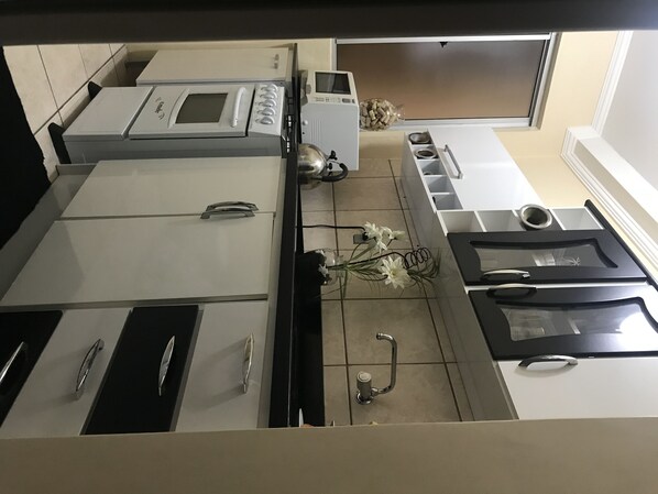 Fridge, microwave, toaster, cookware/dishes/utensils