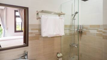 Shower, hair dryer, slippers, towels