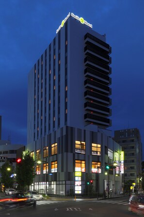 A modern hotel building with illuminated signage and multiple floors. - Smile Hotel Shonan Fujisawa (Fujisawa)