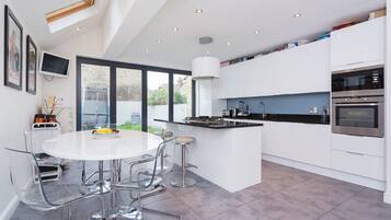 Fridge, oven, dishwasher, dining tables