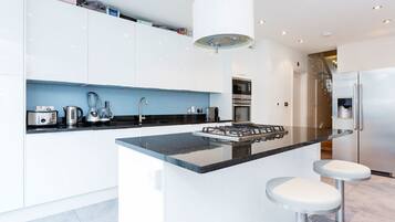 Fridge, oven, dishwasher, dining tables