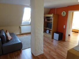 Habitación familiar | Sala de estar | Una televisión de pantalla plana