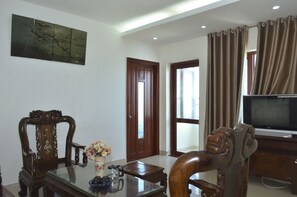 Panoramic Apartment, 2 Bedrooms (13G) | Living room | 21-inch flat-screen TV with cable channels, TV - Thuy Hanh Homestay Vung Tau (Ho Chi Minh City)