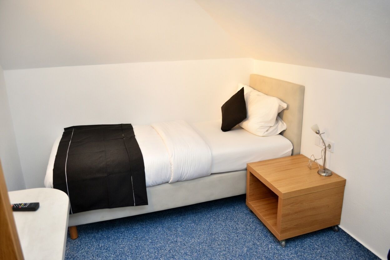 Einzelzimmer | Allergikerbettwaren, individuell dekoriert, kostenloses WLAN