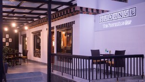 A bar named "SLOUNGE The Recreation Bar" with outdoor seating and a covered patio area. - Lemon Tree Hotel Thimphu (Thimphu)