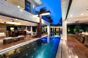 A modern house with a swimming pool, outdoor seating, and a bar area. - Beautiful Villa With Private Pool, Bali Villa 2001 (Seminyak)