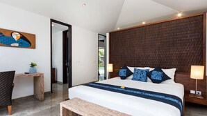 A modern bedroom with a large bed, a wooden headboard, a desk, and a bench. - Bali Villa Near the Beach, 2080 (Seminyak)